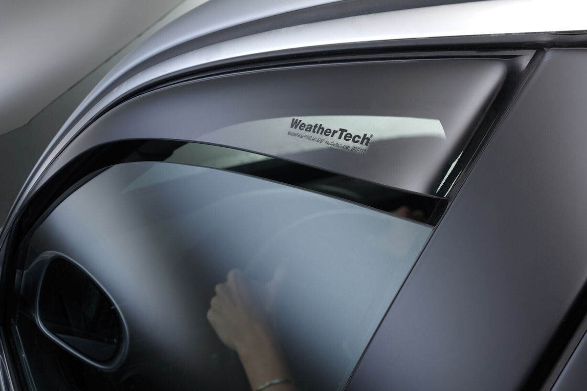 Why should I install wind deflectors on my car?