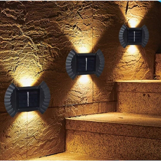 Solar LED Bidirektionale Wandleuchte Flippy Schleifenförmig 8 LEDs ABS PC Material Starkes Licht IP65 10 x 7,5 cm 1,2 V Batterie 300 mAh 8-10 Stunden Autonomie Weiß