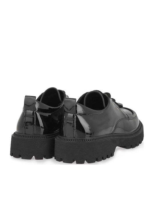 Kinder Slipper & Mokassins aus Schwarz Lackleder