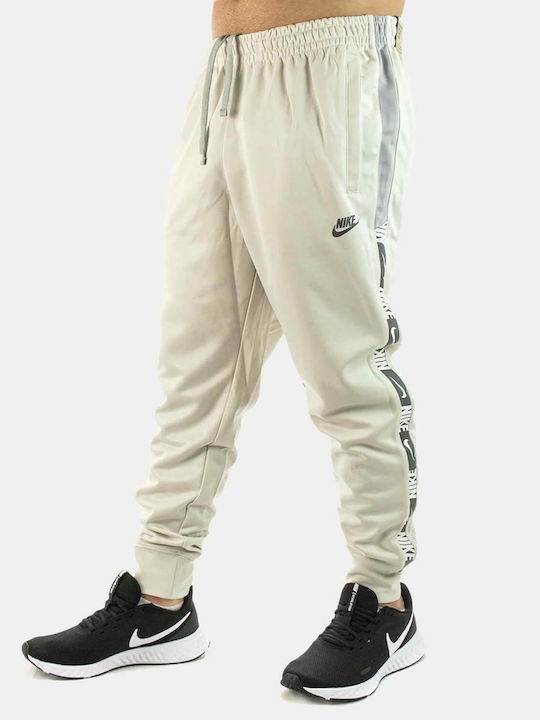 Nike Sportswear Παντελόνι Φόρμας με Λάστιχο Μπεζ
