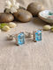 Grekas Silver Stud Earrings with Light Blue Stones